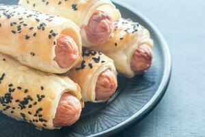 Sausage rolls closeup photo