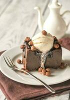 Chocolate brownie with vanilla ice cream photo