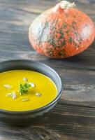 Bowl of pumpkin cream soup photo