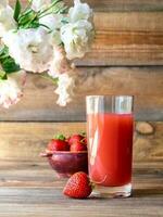 Glass of strawberry juice photo