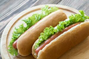 Hot dogs on the wooden board photo