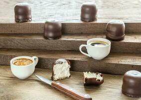 Fresh marshmallows with two cups of coffee photo