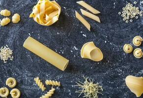 Various types of raw pasta photo