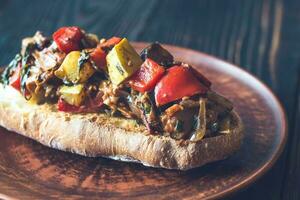 Sandwich with ratatouille on the plate photo