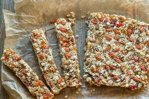 Homemade granola bars on the baking paper photo