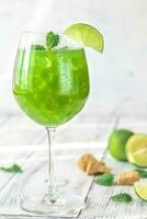 Glass of green mojito photo
