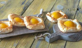 Puff pastry with canned peaches photo