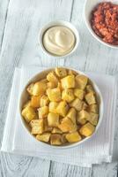 Portion of patatas bravas with sauces photo