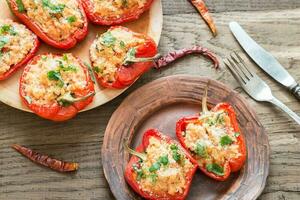 Stuffed red bell peppers with white rice and cheese photo