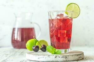 Glass of cherry mojito photo