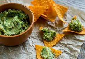 Guacamole with tortilla chips photo