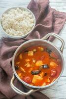 Thai red chicken curry with white rice photo