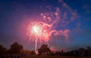 People looking at fireworks in honor of Independence Day photo