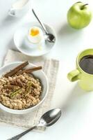Oats with egg and green apple photo