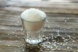 Glass of sea salt photo