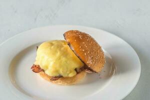 Eggs Benedict on the white plate photo