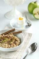 Oats with egg and green apple photo