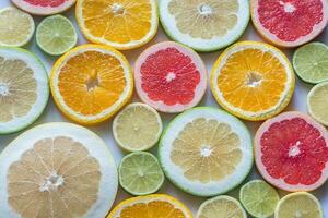 Slices of citrus fruits photo