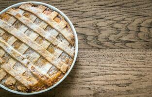 Pumpkin pie on the wooden background photo