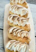 Eclairs with lemon curd and meringue photo