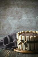 Tiramisu cake on the wooden board photo