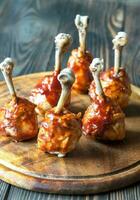 Chicken drumsticks in barbecue sauce photo