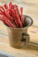 Kabanosy sausages in vintage mug photo