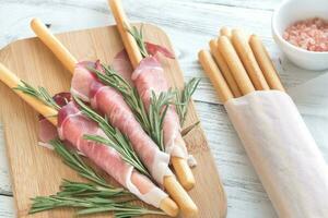 Breadsticks wrapped in ham photo