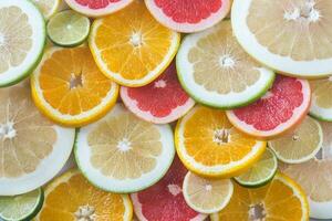 Slices of citrus fruits top view photo