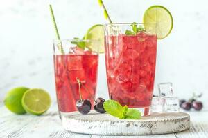 Two glasses of cherry mojito photo