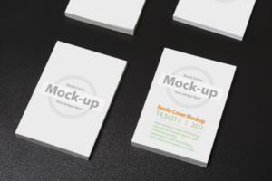 Multiple books with blank cover on dark glossy table psd