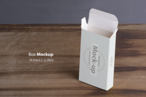 Vertical opened empty pillbox on wooden table background psd