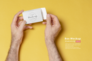 A man hands opening a pillbox in front of yellow background psd