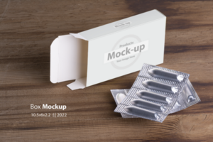 Suppositories loaf and an empty box on wooden table background psd