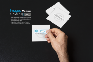 A hand holding a pregnancy test in front of image frames psd