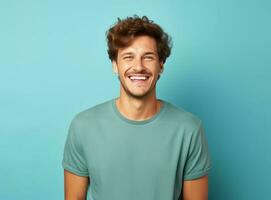 Beautiful man against blue background photo