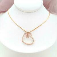 Gold Love Necklace Jewelry on White Display photo