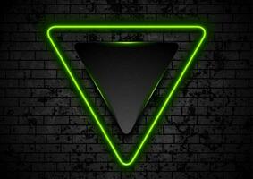 Green neon triangle on dark grunge brick wall background vector