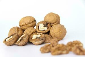 Walnuts in a shell on a white background. Healthy nuts. photo