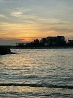 Evening sunlight reflects on the water surface photo