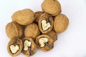 Walnuts in a shell on a white background. Healthy nuts. photo