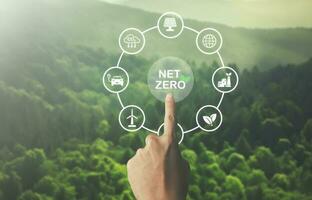 hand pointing at net zero target and carbon credit.CO2 emission reduction to stop global warming problem and reduce pollution into atmosphere from big industrial. photo