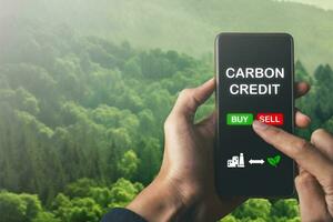 hand pointing at net zero target and carbon credit.CO2 emission reduction to stop global warming problem and reduce pollution into atmosphere from big industrial. photo