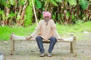 happy indian farmer. banana plant, old poor farmer , worker photo