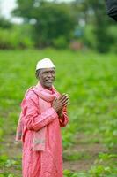 Indian happy farm worker , working in farm photo