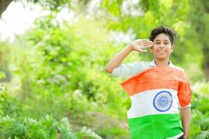 Indian boy holding national flag in farm, happy boy, national flag photo