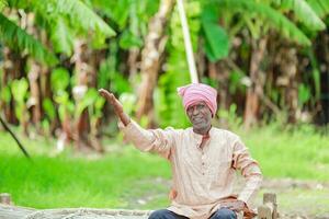 happy indian farmer. banana plant, old poor farmer , worker photo