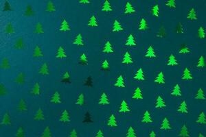 Christmas tree decoration pattern on green. Christmas abstract background photo