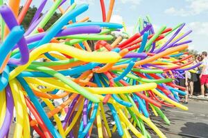 Prague, Czech Republic - August 11, 2018. Close-up on rainbow balloons at the Pride Parade photo