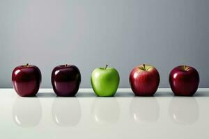 Colorful Apples Line Up on White Surface photo